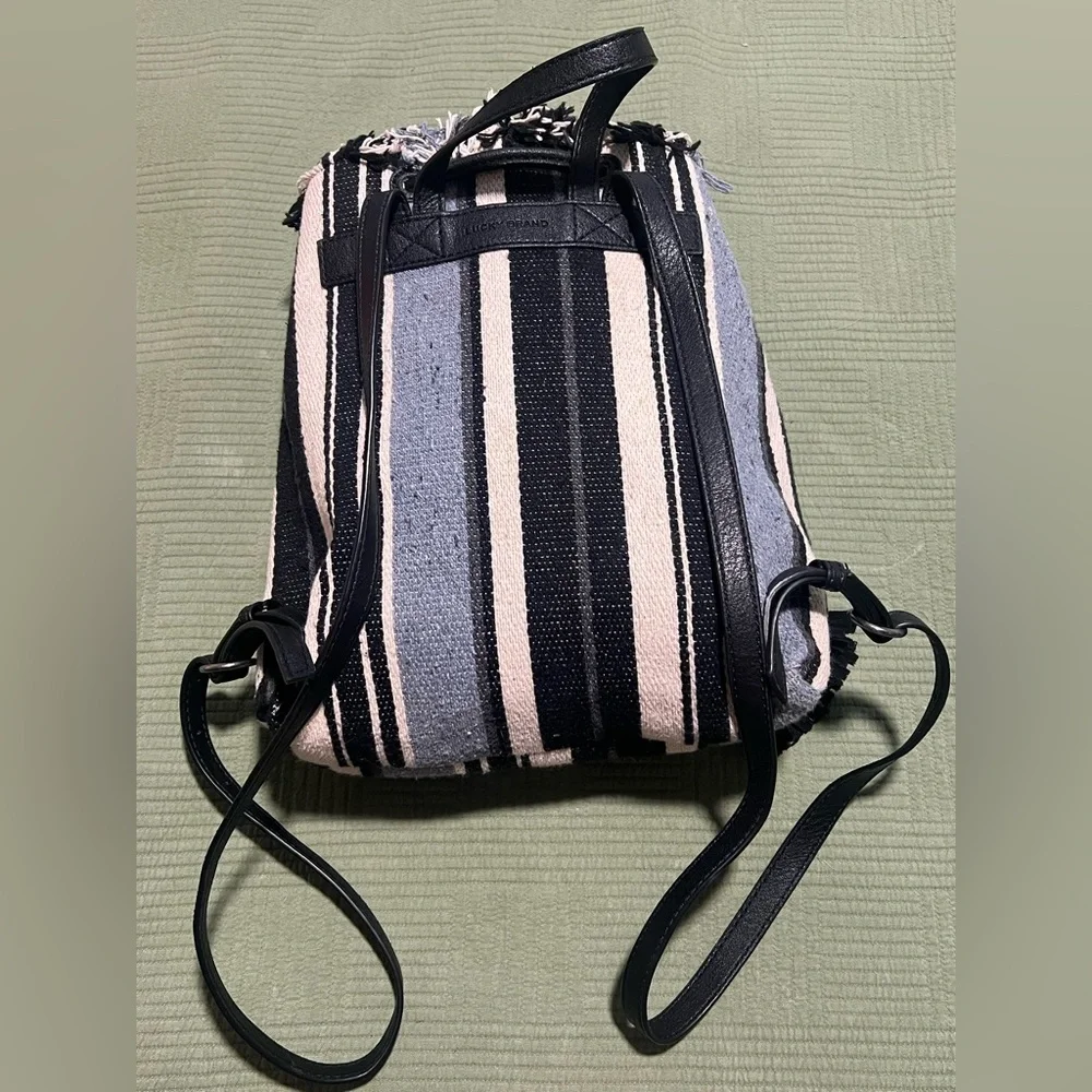 Lucky Brand Alzon Drawstring Clinched Fringed Backpack Blue, Black and Cream